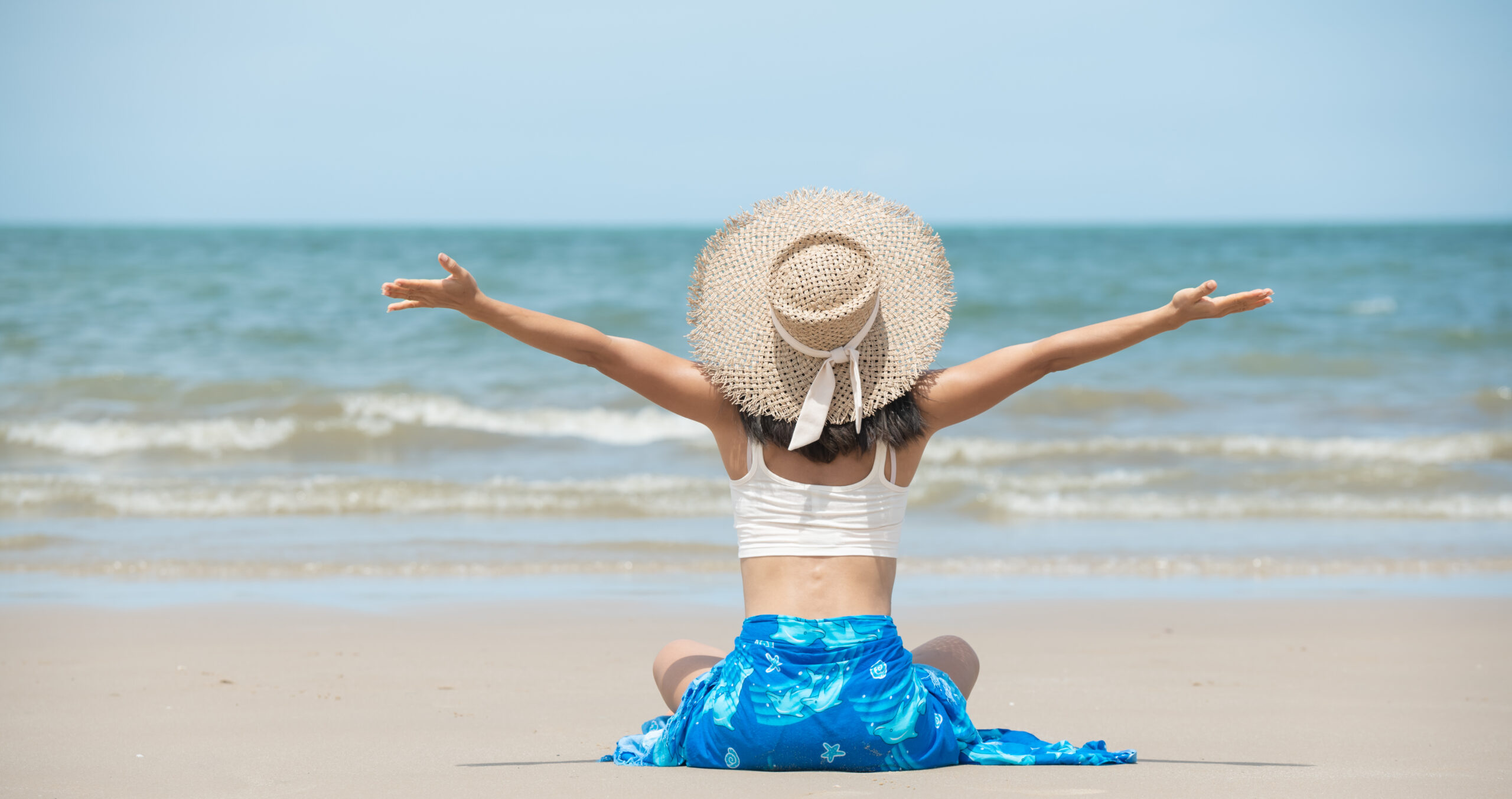 Happy asian woman smiling and having fun at beach. Hot beautiful